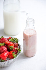 a glass of strawberry shake shown