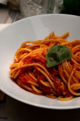 Classic spaghetti and tomato sauce with basil garnish