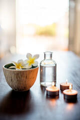 Spa, wellness and essential oil with flower in bowl for aromatherapy, pamper retreat and luxury treatment. Tranquil space, body care salon and empty room for stress relief, relaxation and hospitality