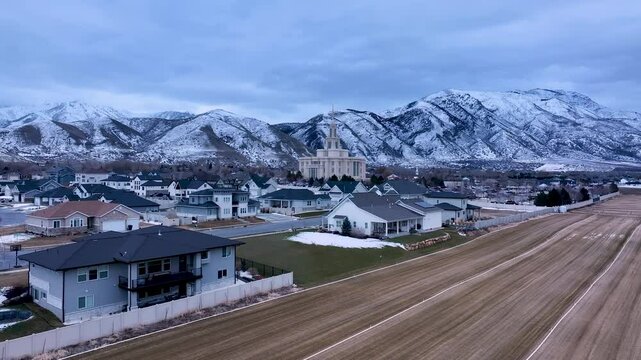 Aerial Payson Utah LDS Temple overhead fast. The Church of Jesus Christ of Latter-day Saints, LDS or Mormon religion. Sacred building for eternal worship. Residential neighborhood.