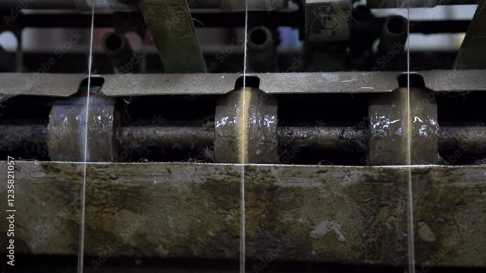 Poster detailed close-up of a spinning machine processing flax fibers into fine yarn. tensioned threads mov