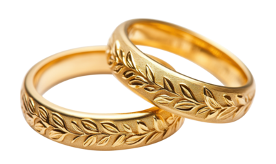 Engraved gold wedding rings with natural pattern, isolated on transparent cutout background