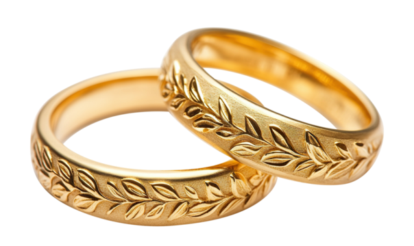 Engraved gold wedding rings with natural pattern, isolated on transparent cutout background