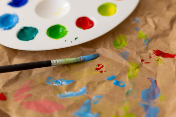 Vibrant colors and tools used for decorating Easter eggs in a springtime setting