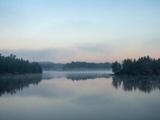 landscape with fog on a lake