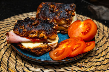 Ready -made cheese sandwich with ham and tomato