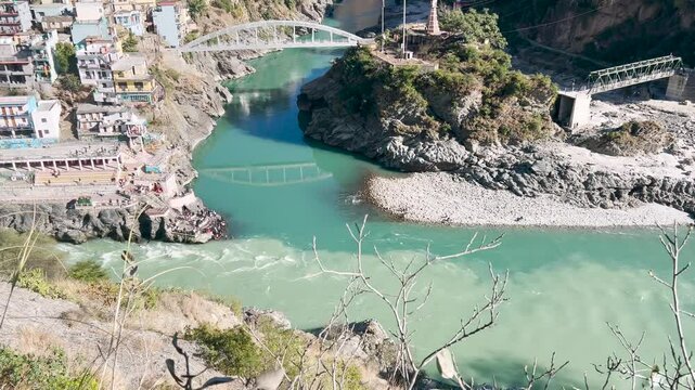 view of the river with green shades. Two different shades of green. Devprayag - the meeting of two rivers alaknanda and bhagirati flow in as ganges or ganga river