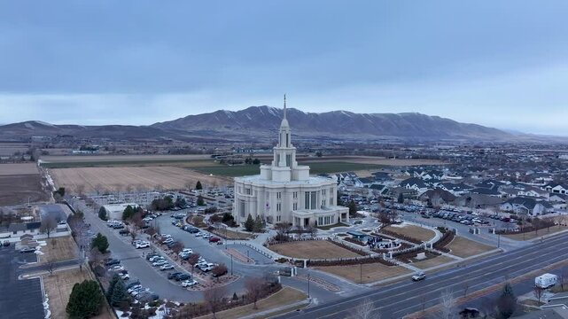 Aerial LDS Temple Payson Utah mountain valley circle 2. The Church of Jesus Christ of Latter-day Saints, LDS or Mormon religion. Sacred building for eternal worship. Residential neighborhood.