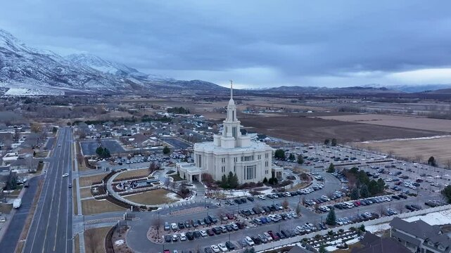 Aerial LDS Temple Payson Utah mountain valley circle 1. The Church of Jesus Christ of Latter-day Saints, LDS or Mormon religion. Sacred building for eternal worship. Residential neighborhood.
