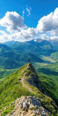 Lone hiker at mountain peak during golden hour remote landscape view wide angle