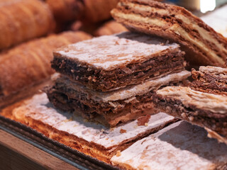 Italian Bakery counter, Window of desserts at a pastry shop. Fresh and tasty products