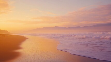 A serene beach at sunset, with gentle waves lapping at the shore and soft colors in the sky.