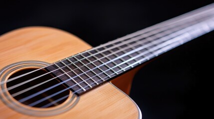 Fototapeta premium Acoustic guitar close-up, strings, soundhole, dark background, music
