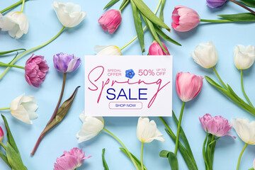 Greeting card with text MOTHER'S DAY and beautiful tulips on blue background