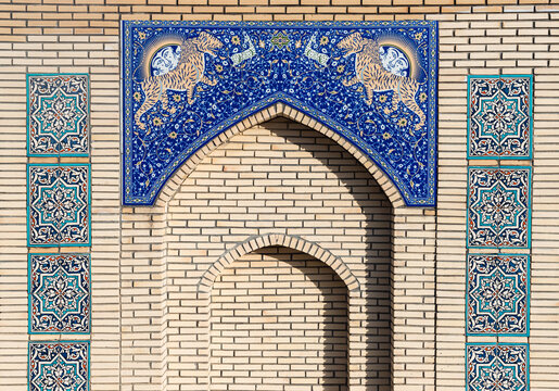 Miniature of Registan Madrasah in Samarkand with illustration of tigers or lions on blue ceramic mosaic at brick wall, traditional eastern archs and patternt,  Tashkent, Uzbekistan, 26 January 2025 - Powered by Adobe