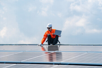 Engineer service check installation solar cell on the roof of factory By laptop, Sustainable energy industry concept, Renewable energy solution for climate change
