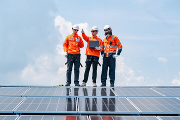 Technician team checks the maintenance of the solar panels on the roof, Sustainable energy industry...