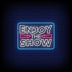 Obraz premium enjoy the show neon sign with brick wall background vector