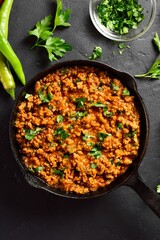Indian meal Keema curry in cast iron pan