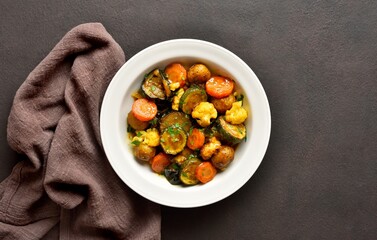 Stewed vegetables on plate, top view
