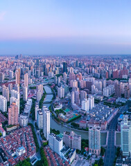 Fototapeta premium Aerial view of high-rise buildings and residential houses on the Bund in Shanghai