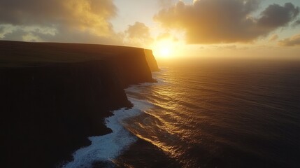 Obraz premium Dramatic Sunset Over Coastal Cliffs and Ocean Waves