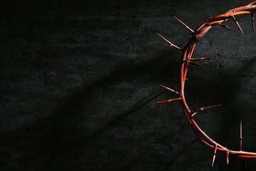 Crown of thorns on black grunge background