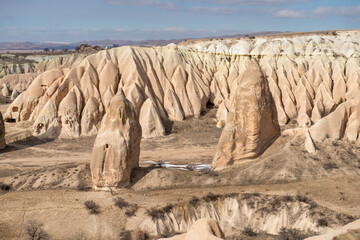 Rock formations of the Red Valley (Valley of Roses), Cappadocia, Turkey , in winter.