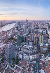 Fototapeta premium Aerial View of Shanghai skyline at sunrise with the Winding River