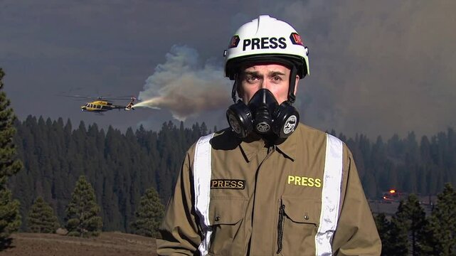 Journalist reporting breaking news as large fire rages behind, seamless looping animation, Generative AI