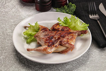 Grilled quail in the plate