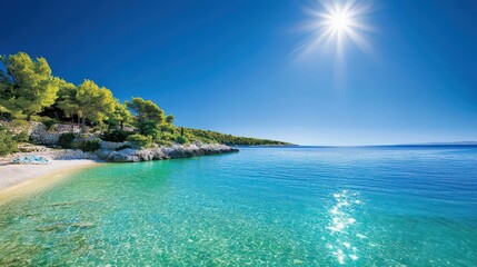 Crystal-clear turquoise sea under the midday sun, surrounded by lush green nature and a bright blue sky above