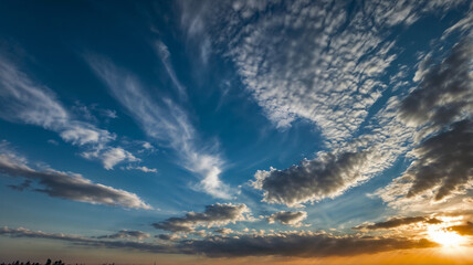 Fototapeta premium A clear blue sky with lots of fluffy white clouds.