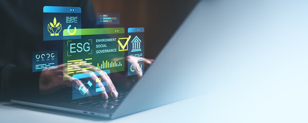 ESG digital concept with environmental, social, and governance metrics displayed as holograms over...