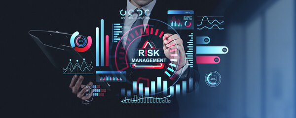 Businessman analyzing digital risk management data with futurist