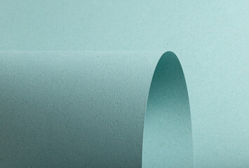 A pastel blue textured paper background with punched and perforated details, featuring soft shadows...