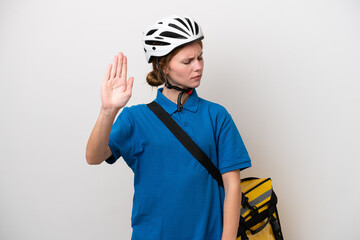Young English woman with thermal backpack isolated on white background making stop gesture and disappointed