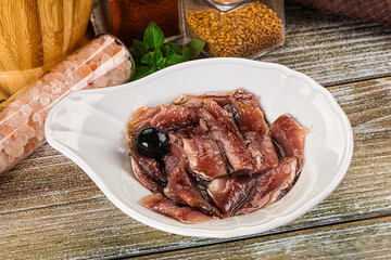 Canned anchovy with oil in the bowl