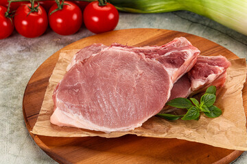 Raw pork steak loin with bone
