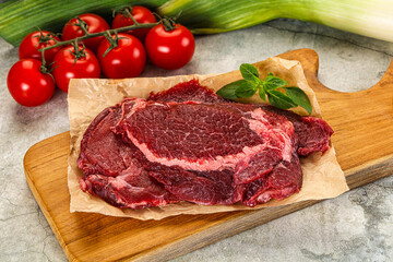 Raw beef cheeks cut for cooking