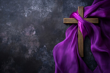 Christianity cross wrapped with purple clothes with copy space