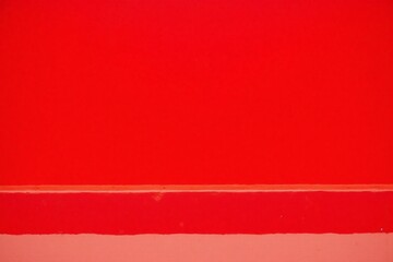 Fototapeta premium minimalist modern scene with bright red painted wall