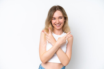 Naklejka premium Blonde English young girl isolated on white background smiling and showing victory sign