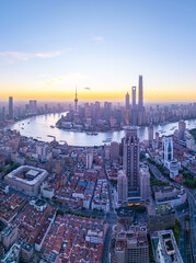 Obraz premium Aerial view of shanghai skyline and winding river at sunrise