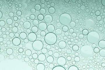 Macro microscope green bubble texture, Close-up Green bubbles and drops oil background . blue green water bubbles, close up golden oil drop for cosmetic...