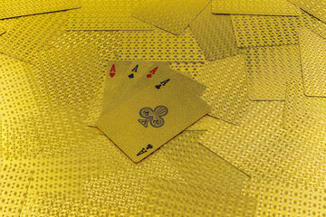 A deck of gold cards placed on a poker table, cards in pure gold, 4 ass