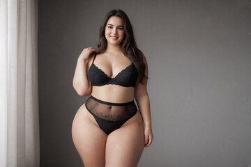 Curvy plus size model redhead woman plus size model in lingerie