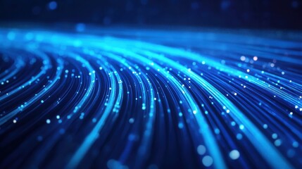 Wavy Blue Light Trails on a Dark Gradient Background Symbolizing Energy and Motion