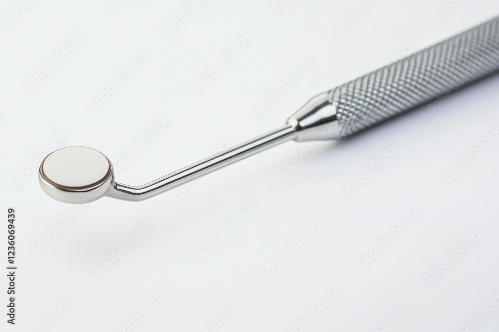 Poster close-up shot of a metal object on a white surface, suitable for use in product design or manufactur