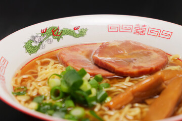 Soy sauce ramen noodles with grilled pork, bamboo shoots, and green onions, a noodle dish that has long been a favorite in Japan